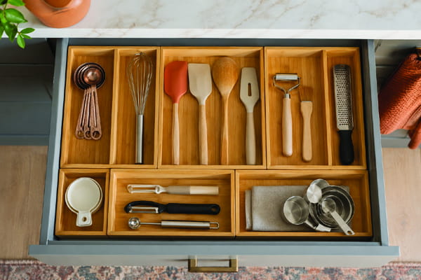 Organized small kitchen drawer with dividers for utensils and tools