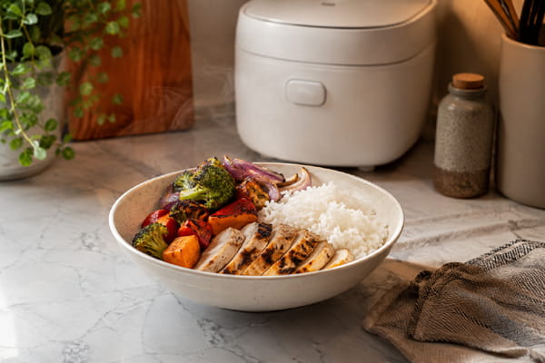 Solo rice bowl meal prepared with a compact rice cooker